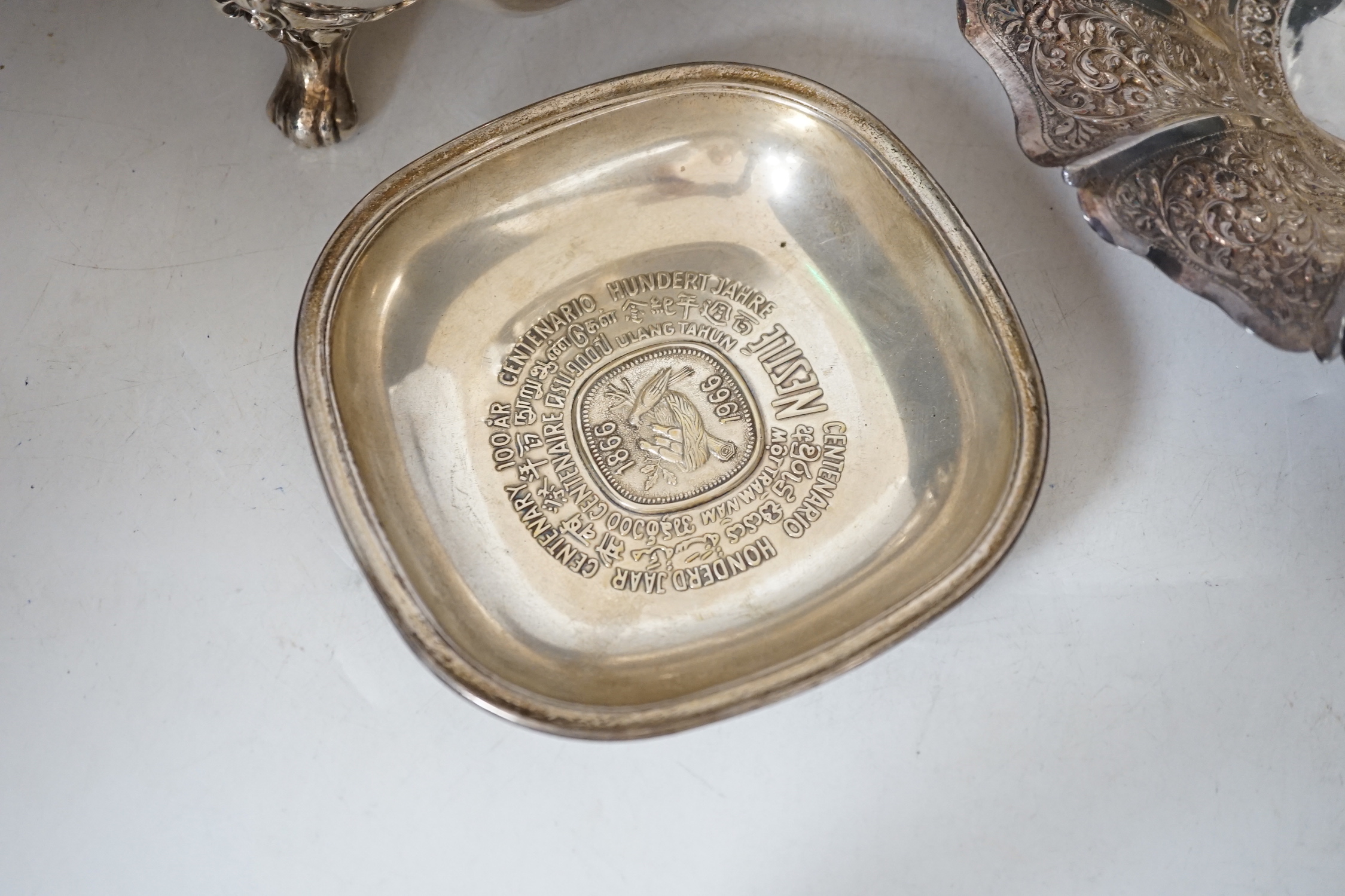A quantity of assorted 19th century and later plated wares, including two salvers, mounted glass lemonade jug, a warming dish base, pair of wine coasters, rattle Knight's helmet lighter, Christofle and other cutlery, a s